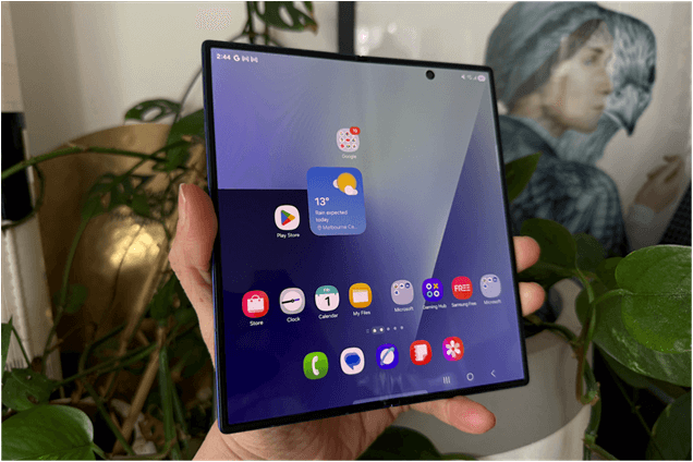Samsung Galaxy Z Fold 7 unfolded to tablet mode showing large, vibrant display with app icons visible.